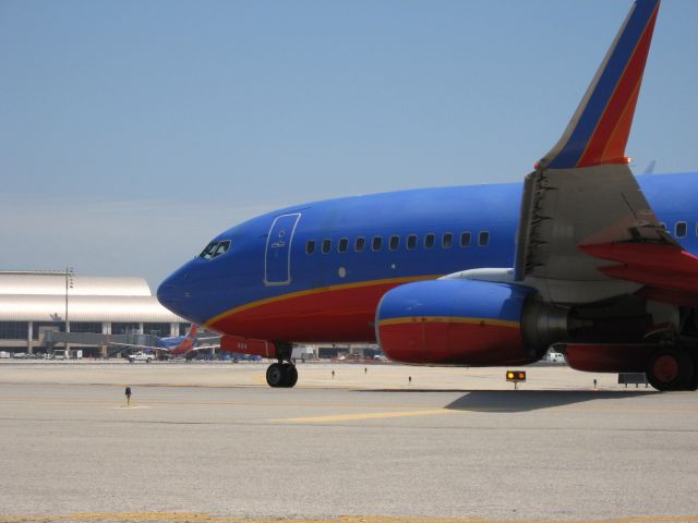 Boeing 737-700 (N484WN) - Holding short of RWY 19R