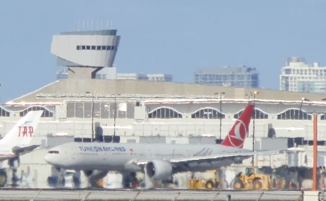 BOEING 777-300ER (TC-JJO) - Arriving to the gate"After the Flight from Istanbul"See the heat rising up off the tarmac!