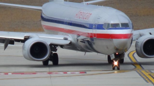 Boeing 737-800 (N562NN) - A new 737-823 arriving from Miami to Raleigh-Durham (RDU)turning off runway 5L. 