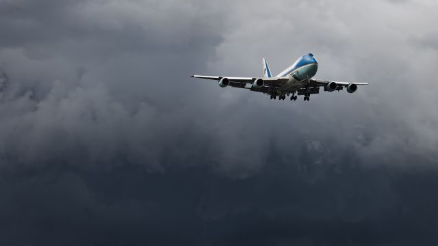 Boeing 747-200 (N29000) - Threading the needle. AF-1 threading the needle  with large Thunderstorms near the short final to 19L