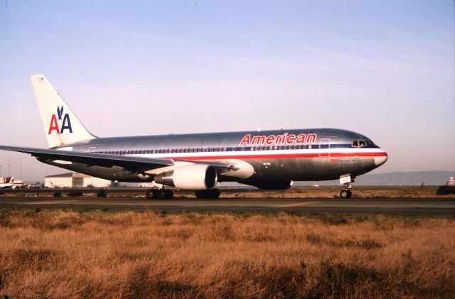 BOEING 767-200 (N305AA) - KSFO - American 767-2 idling to Runway 1R at San Francisco for departure. Photo by me in late PM fall 1993. Color slide converted/digital.CN: 22311 LN:34br /Type 767-223 scrapped ROS 9/2003.