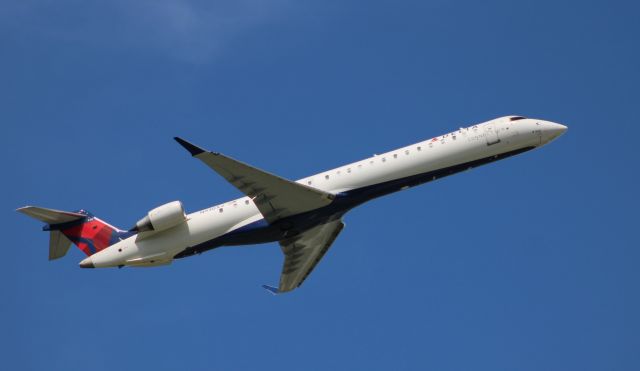 Canadair Regional Jet CRJ-900 (N930XJ) - Shortly after departure is this 2007 Delta Connection Canadair Regional Jet 900LR from the Summer of 2020.