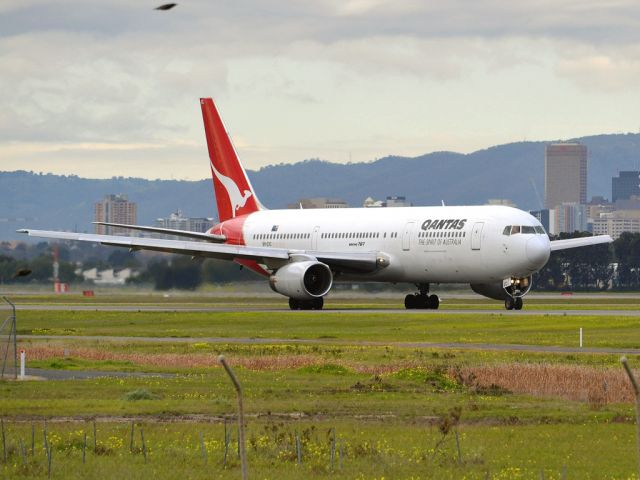 BOEING 767-300 (VH-ZXC) - On taxi-way heading for take off on runway 05, for flight to Sydney. Thursday 12th July 2012.