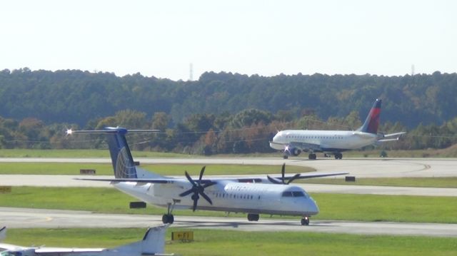 de Havilland Dash 8-400 (N341NG) - As a United Dash Q402 taxes, Delta 5812 arrives from Orlando.