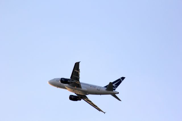 Airbus A318 (YR-ASC) - Take off against the Sunset as seen from the Parking in front of Departures entrance of Henri Coanda Airport, Bucharest.