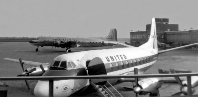 VICKERS Viscount (N7412) - An old Kodak film print I snapped in the mid 1960s shows a scene from the propliner and propjet era.  A United (previously Capital Airlines) Viscount (N7412) is seen at Greater Buffalo Internationals (now Buffalo Niagara International - KBUF) Gate 1 as an American DC-6 taxies away in the background.