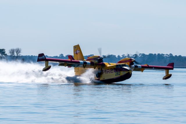 Canadair CL-415 SuperScooper (N417BT) - N417BT CL-415 lands on Lake Conroe on 10 February 2022. Taken from the Wake on Lake Conroe Restaurant