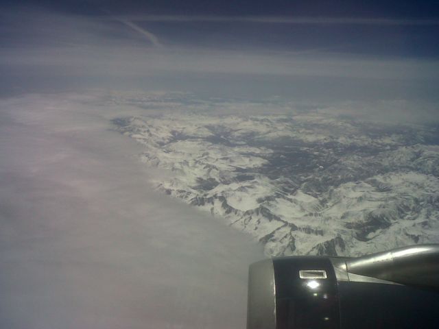 Airbus A320 — - Flying east out of SFO over the snow covered Sierra Nevada. US Airways Flight #658, KSFO-KPHL, aircraft is A320, picture taken on 4-16-12.