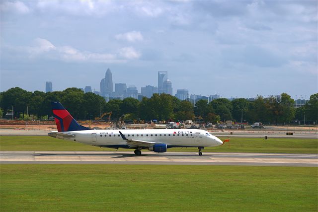 N201JQ — - 201JQ taking off on Rwy 18C with the Charlotte skyline in the background