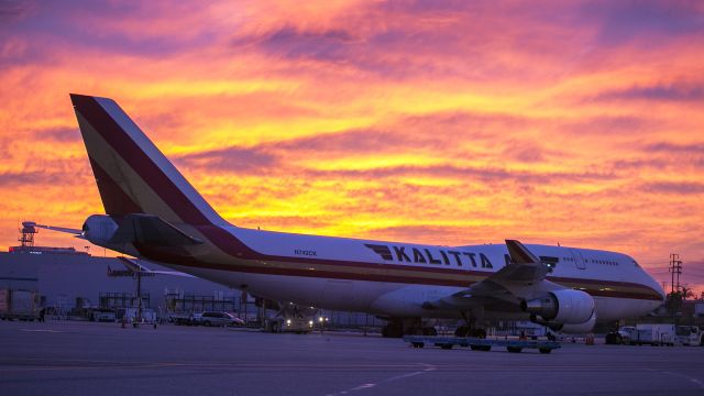 Boeing 747-400 (N742CK) - This Kalitta 747 cargo plane unloads at LAX during a magnificent sunrise. 20 Dec 2014 