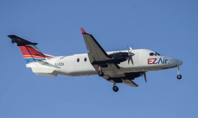 Beechcraft 1900 (PJ-EZA) - over the numbers 