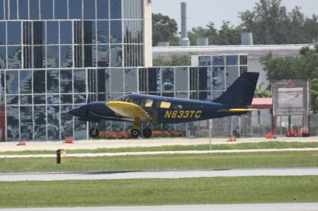 Piper Seneca (N633TC) - Piper Seneca (N633TC) performs a touch and go at Sarasota-Bradenton International Airport