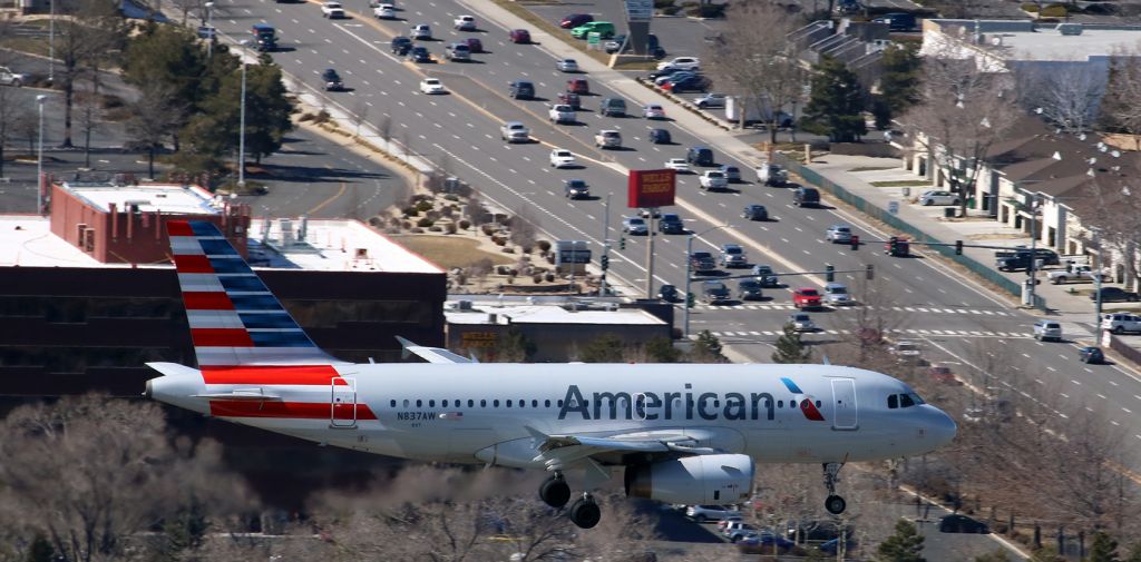 Airbus A319 (N837AW) - Americans N837AW is clicked here at five minutes past high noon as it is about to pass over South McCarran Blvd while on its s/final to Reno Tahoe Internationals 34L.br /If best Q viewing is desired, I recommend clicking on FULL.