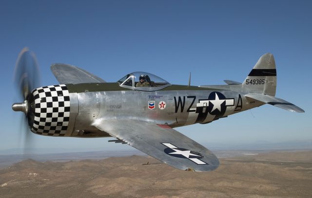 NX47DF — - A Republic P-47D Thunderbolt in the air above the California desert.