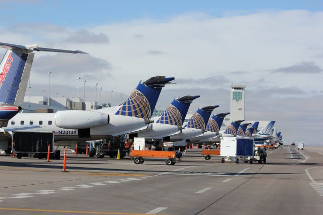 Embraer EMB-145XR (N23139) - Regional jets lined up at their gates on B concourse at DIA.