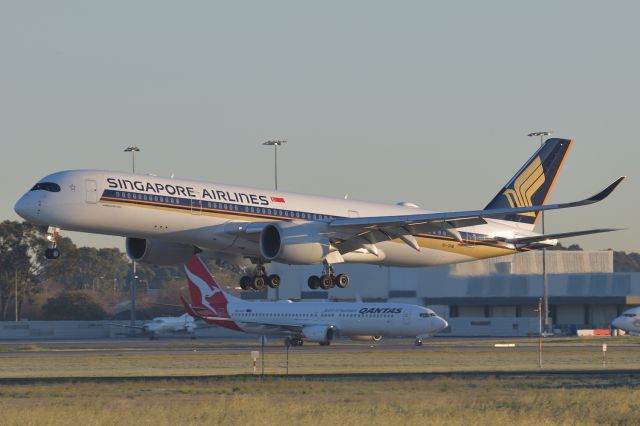 Airbus A350-900 (9V-SHB) - Adelaide, South Australia, August 25, 2020. br /br /SIA Flt 279 from Singapore is over the threshold of Rw 23 at 0714 as VH-VZY, QF Flt 724 to Canberra waits on Bravo 2 for clearance onto the runway to depart on its service.