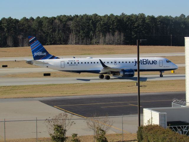 Embraer ERJ-190 (N328JB) - JetBlue flight 1084 to Logan Intl, an Embraer 190 taxiing to takeoff on runway 23R. This was taken January 30, 2016 at 3:30 PM.