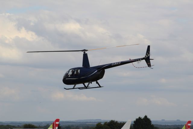 Robinson R-44 (G-RULE) - A Private owned Helicopter taking off from Cotswold Kemble Airport.br /br /Location: Cotswold Kemble Airport.br /Date: 31.08.22 (dd/mm/yy).