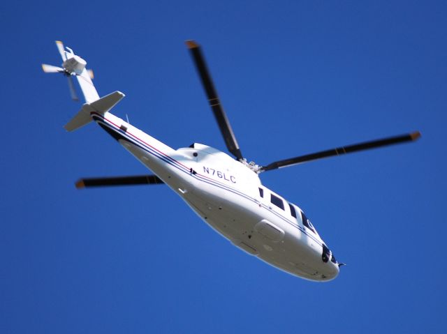 Sikorsky S-76 (N76LC) - LOWES CO INC crossing the field, headed to the Charlotte Motor Speedway for the Coca-Cola 600 at KJQF - 5/26/13