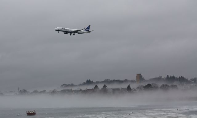 Embraer ERJ-190 (N375JB) - Landing over icy waters with fog just above the water!