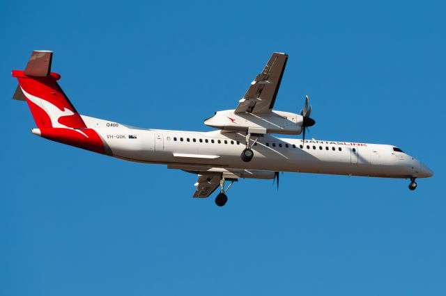 VH-QOK — - QOK landing on Runway 09 at Melbourne Airport on a sunny evening. 1 letter off from being the opp's plane.