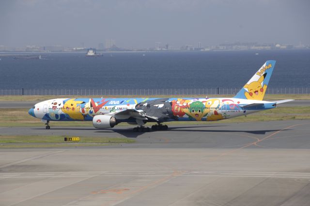 BOEING 777-300 (JA754A) - Taxi at Haneda Intl Airport on 2011/7/25 New Pokemon Peace Jet c/s