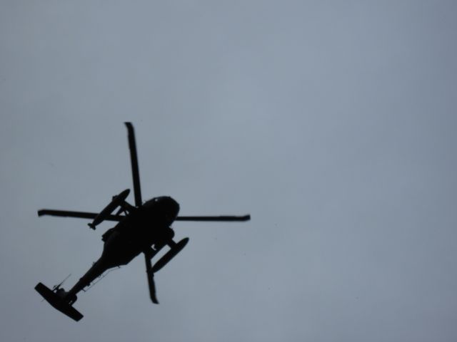 — — - Blackhawk doing touch and goes on a cloudy day directly overhead. Had the camera backed all the way in no zoom.