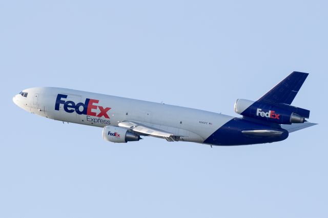 McDonnell Douglas DC-10 (N383FE) - Just after sunrise, departing 10L at Chicago OHare from the top of the MB Park.