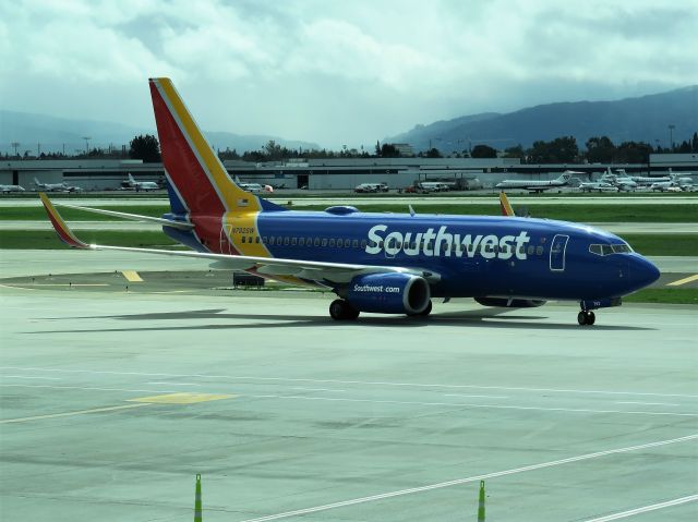 Boeing 737-700 (N792SW) - From inside Terminal B at SJC, 3-15-18