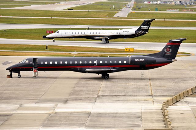 Embraer ERJ-145 (N500DE) - 08-15-21. Hendricks Motor Sports N509RH taxiing in the back ground.