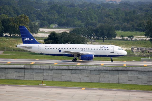 Airbus A320 (N535JB) - JetBlue, N535JB, taxing to the gate in Tampa, Florida.  Photo by John A. Miller, a rel=nofollow href=http://www.PhotoEnrichments.comwww.PhotoEnrichments.com/a