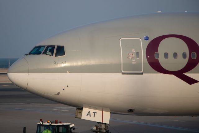 BOEING 777-300 (A7-BAT) - A7-BAT pushing back as we were arriving.