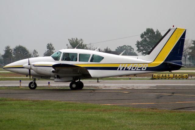 Piper Aztec (N14028) - Taxiing to depart rwy 19 on 12-Oct-06.