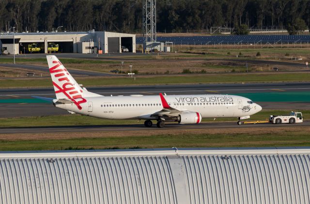 Boeing 737-800 (VH-YFU) - Towed to domestic terminal.