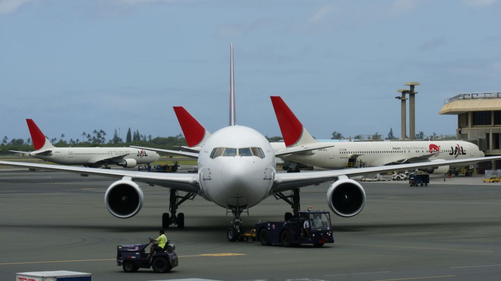 BOEING 767-300 (N592HA) - Push back with JAL in background.