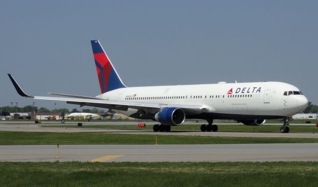 BOEING 767-300 (N184DN) - DIVERSION!! This 767-300 was supposed to be going from JFK-ANC but diverted to BUF for an electrical issue. The plane stayed overnight and departed the next day. Such a cool sight; seeing heavies divert to smaller airports like BUF! (taxi shot)