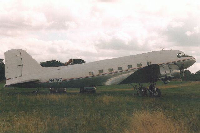 Douglas DC-3 (N47AZ) - Seen here in Aug-94.br /br /Registration cancelled 22-Feb-06 as exported to UK, but broken up at HKNW.