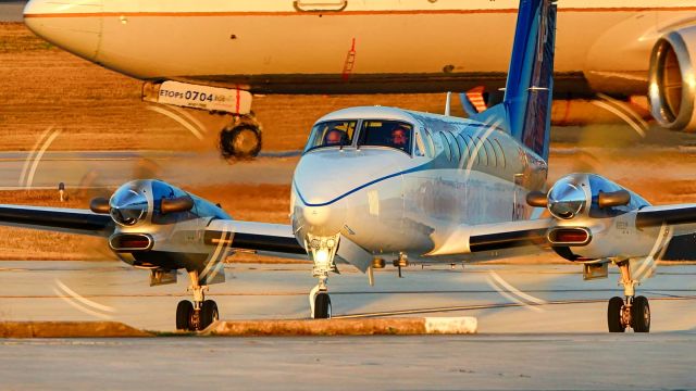 Beechcraft Super King Air 350 (N817UP) - Taxiing onto ramp at sunset.