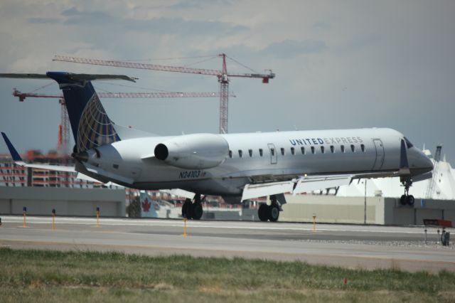 Embraer EMB-145XR (N24103) - Landing on 35L.