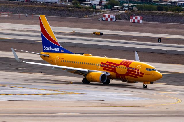 Boeing 737-700 (N781WN) - Southwest Airlines 737-700 in New Mexico One special livery taxiing at PHX on 11/1/22. Taken with a Canon 850D and Tamron 70-200 G2 lens.