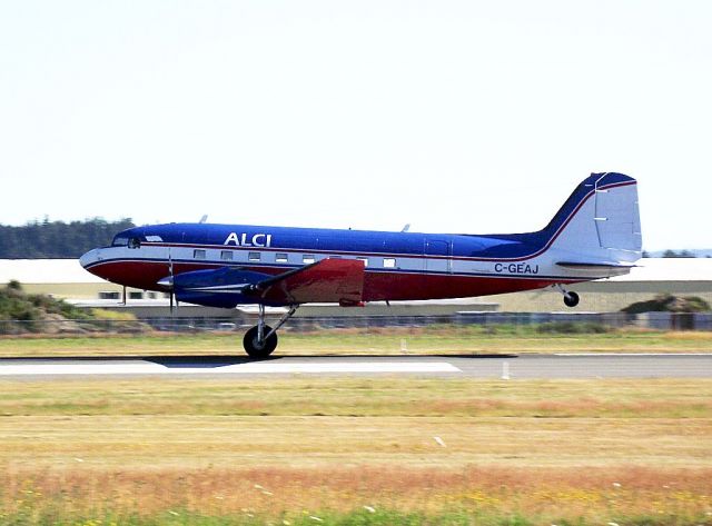 Douglas DC-3 (turbine) (C-GEAJ) - Early morning and up-sun but I couldn't resist a landing shot.