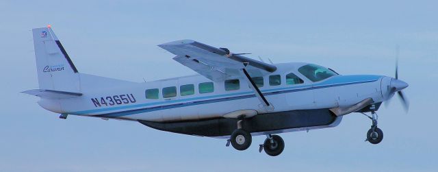 — — - If you look closely the pilot of 65U is looking my way as he makes another freight run.