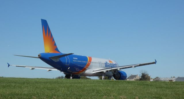 Airbus A320 (N235NV) - Turning on the active runway for departure is this 1999 allegiant Airbus A320-214 in the Autumn of 2020.