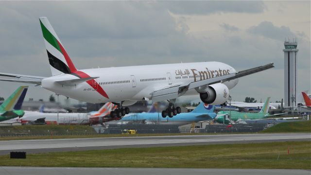 BOEING 777-300 (A6-EGU) - BOE199 (LN:1028) on final approach to runway 16R and completion of its maiden flight on 7/2/12.