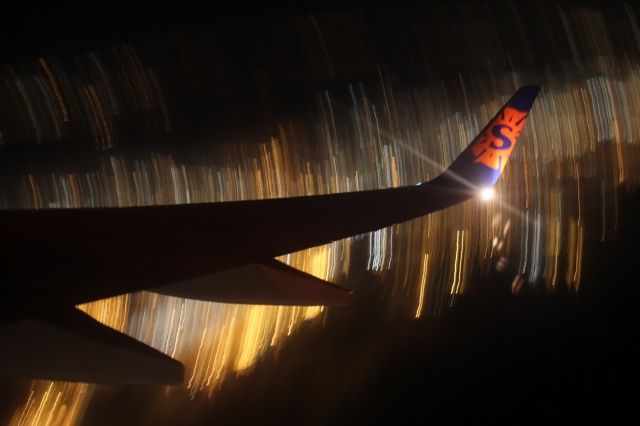 Boeing 737-700 (N714SY) - Sorry about the blurriness! This was my first time at night photgraphy from the plane