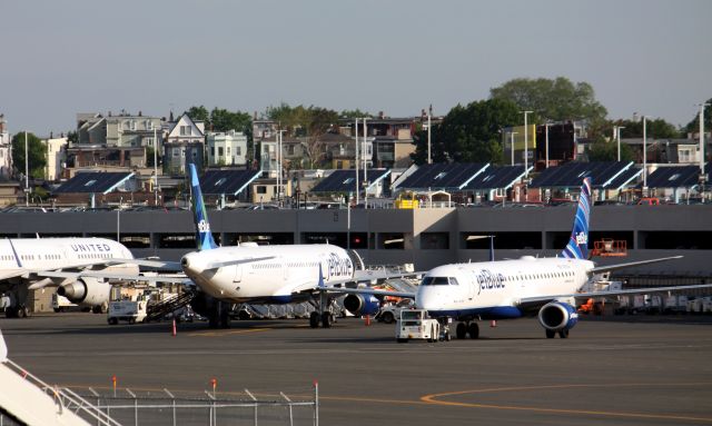 Airbus A321 (N949JT) - Parked next to E-190 early morning at Logan. 