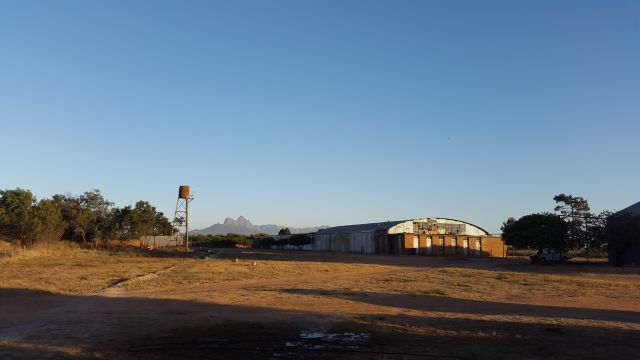 — — - Late afternoon with a view of the Cape Mountains over B hangars