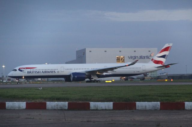 Airbus A350-1000 (G-XWBH) - A British Airways A350-1000 taxiing to runway 27R. br /br /Location: Northern Perimiter Road, beside runway 27R.br /Date: 27.10.22 (dd/mm/yy).