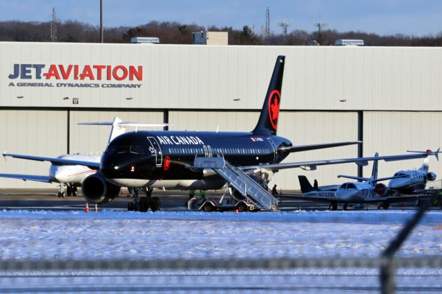 Airbus A320 (C-FNVV) - Air Canada Jetz in their special Black livery at Hanscom.