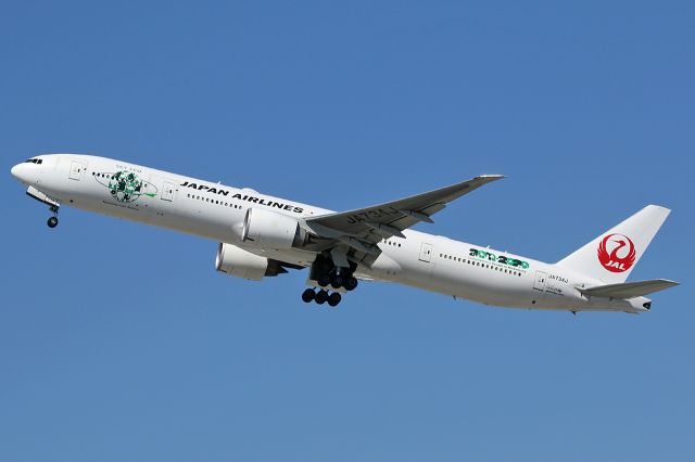 BOEING 777-300ER (JA734J) - Takes off.